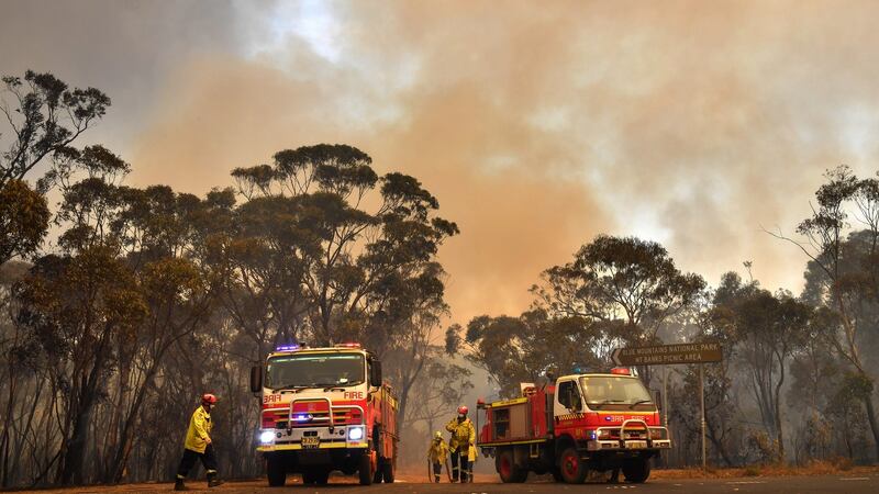 New South Wales Rural Fire Service work to contain fire along the Blue Mountains National Park, north west of Sydney, Australia. Photograph: Dean Lewins/EPA.