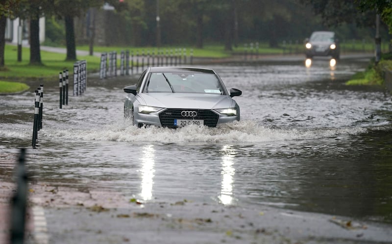 A car driving through floodwater in Cork. Weather warnings will come into force as the UK and Ireland brace for the arrival of Storm Agnes, which will bring damaging winds and big stormy seas. Agnes, the first named storm of the season, will affect western regions of the UK and Ireland, with the most powerful winds expected on the Irish Sea coasts. Picture date: Tuesday September 26, 2023. PA Photo. Photo credit should read: Niall Carson/PA Wire