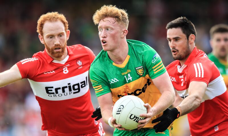 Donegal's Oisín Gallen comes under pressure from Conor Glass and Christopher McKaigue of Derry in Ballybofey. Photograph: Evan Treacy/Inpho