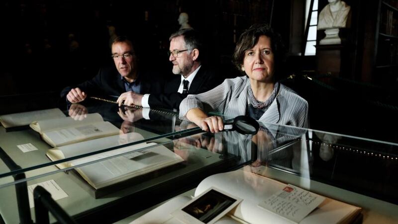 Chris Morash, Seamus Heaney Professor in Irish Writing,  Trinity College Dublin keeper of manuscripts Bernard Meehan  and college librarian and archivist Helen Shenton with  the new collection of Samuel Beckett letters. Photograph: Maxwells