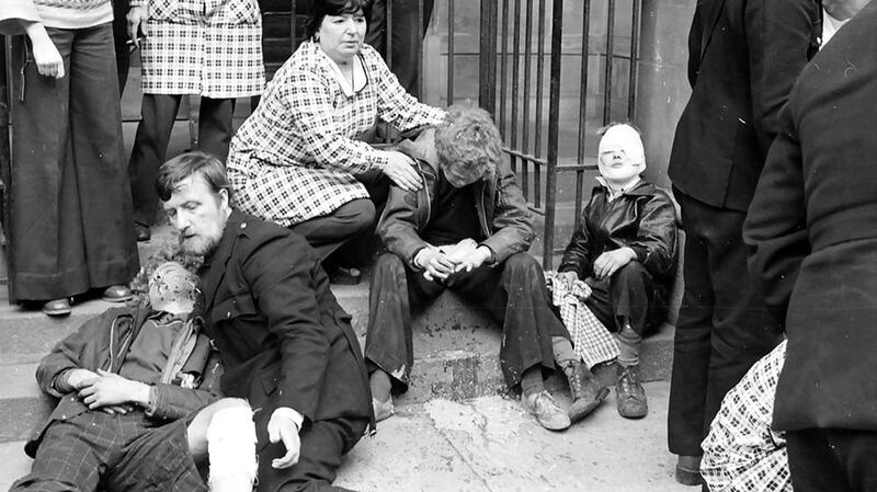 Photograph by Alan Lewis: One Monday in 1974, I was coming out of a building in High Street when I heard an explosion. There were three kids who’d been in the explosions sitting on the steps of the Masonic Hall. As the pictures were coming up, I stopped to look at what I had been taking. I saw the kids sitting there, on a day off school, caught up in a bomb through no fault of their own. I just started crying in the darkroom