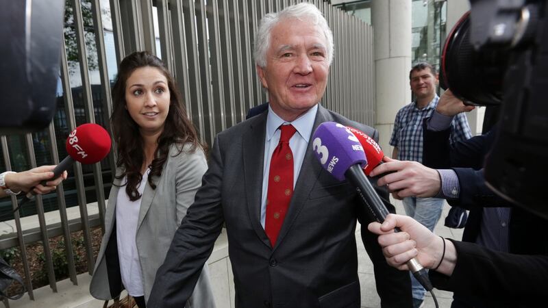 Former chairman of Anglo Irish Bank Seán FitzPatrick with his daughter Sarah at Dublin Circuit Criminal Court after he was acquitted on all charges. Photograph: Collins Courts