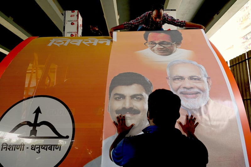 Workers attach a photograph of Indian prime minister Narendra Modi to an election campaign vehicle in Mumbai on April 27th. Photograph: Indranil Mukherjee/AFP via Getty Images