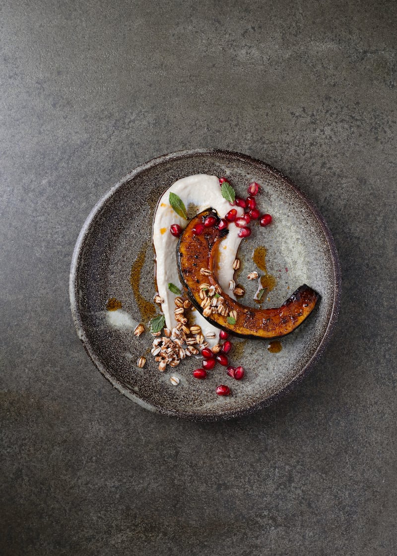 Smoky za’atar roast squash, lemon tahini, popped barley, mint, pomegranate. Photograph: Ruth Calder-Potts