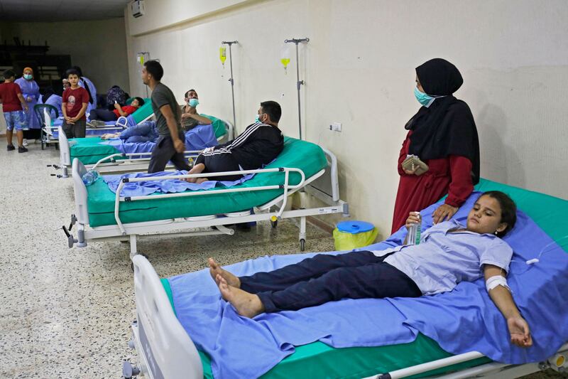 Patients infected by cholera receive treatment in a mosque hall converted into a field hospital in the town of Bebnine in the Akkar district in north Lebanon. Photograph: Ibrahim Chalhoub/Getty Images