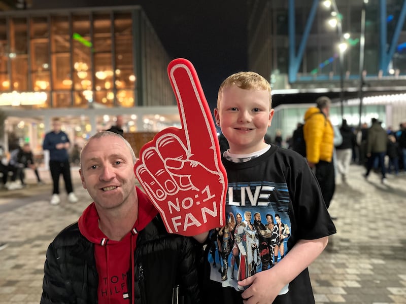 Wrestling fans James Lawless snr and James Lawless jnr on their way to watch WWE Live! at 3Arena in Dublin in November 2024. Photograph: Conor Capplis