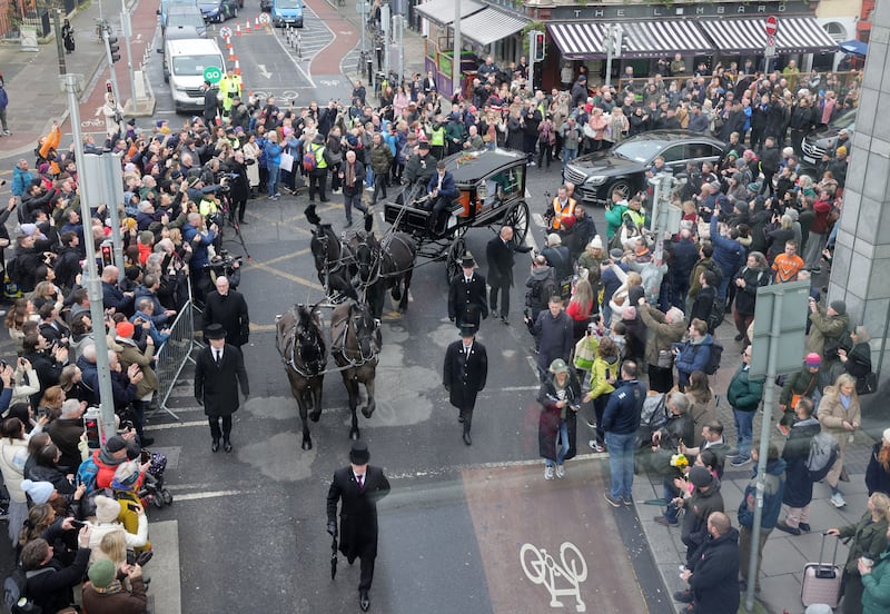 The Funeral procession of Singer Shane MacGowan passing Pearse Street and Westland Row. Photograph: Alan Betson
