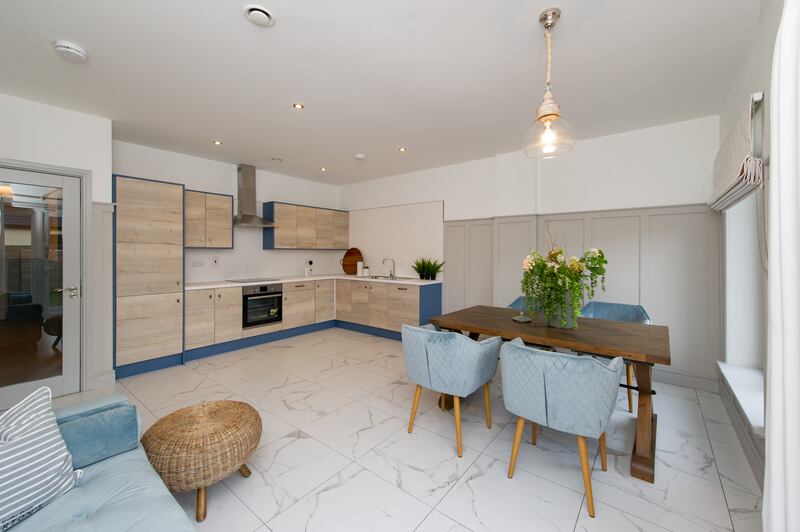 The kitchen-dining area in a three-bedroom unit