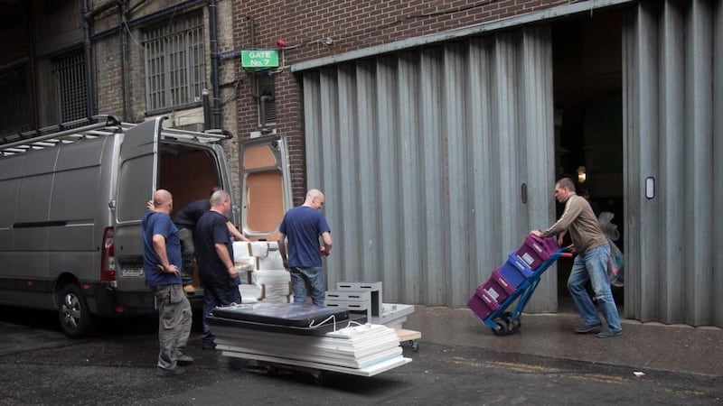 Stock being removed from the back of Clerys on Wednesday following the sudden closure of the department store.  Photograph: Gareth Chaney/Collins