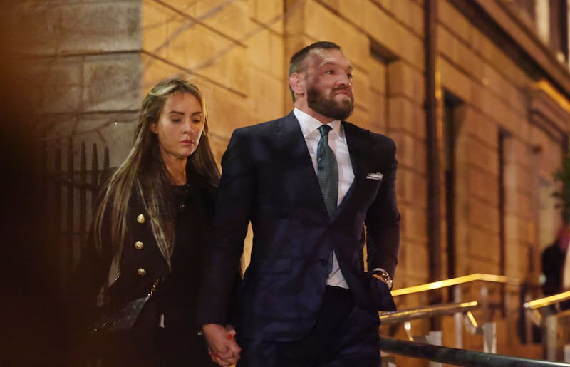 Conor McGregor, accompanied by his fiancée Dee Devlin, leaving the  Four Courts on Friday after the jury delivered the outcome of the civil case taken by Nikita Hand. Photograph: Alan Betson
