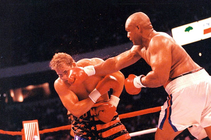 George Foreman lands a right hook on Tommy Morrison at the Thomas & Mack Center in Las Vegas, Nevada, in June 1993. Morrison won by a UD 12. Photograph: The Ring Magazine via Getty Images