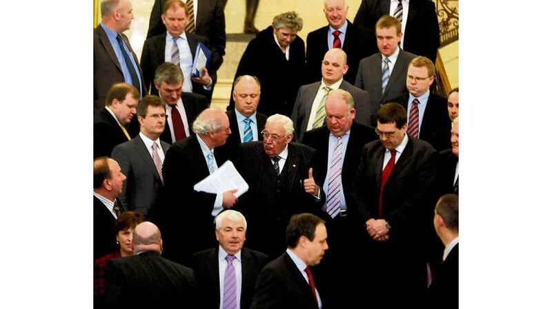 Deputy leader Nigel Dodds: read a statement announcing the party was standing by Peter Robinson. Photograph: Paul Faith/PA Wire Former first minister Ian Paisley gives a thumbs up to DUP members at Stormont yesterday morning. Photograph: Charles McQuillan/Pacemaker