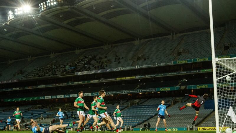 Dublin’s Dean Rock scores his side’s first goal past Mayo goalkeeper David Clarke in the All-Ireland SFC final at Croke Park on Saturday. Photograph: James Crombie/Inpho