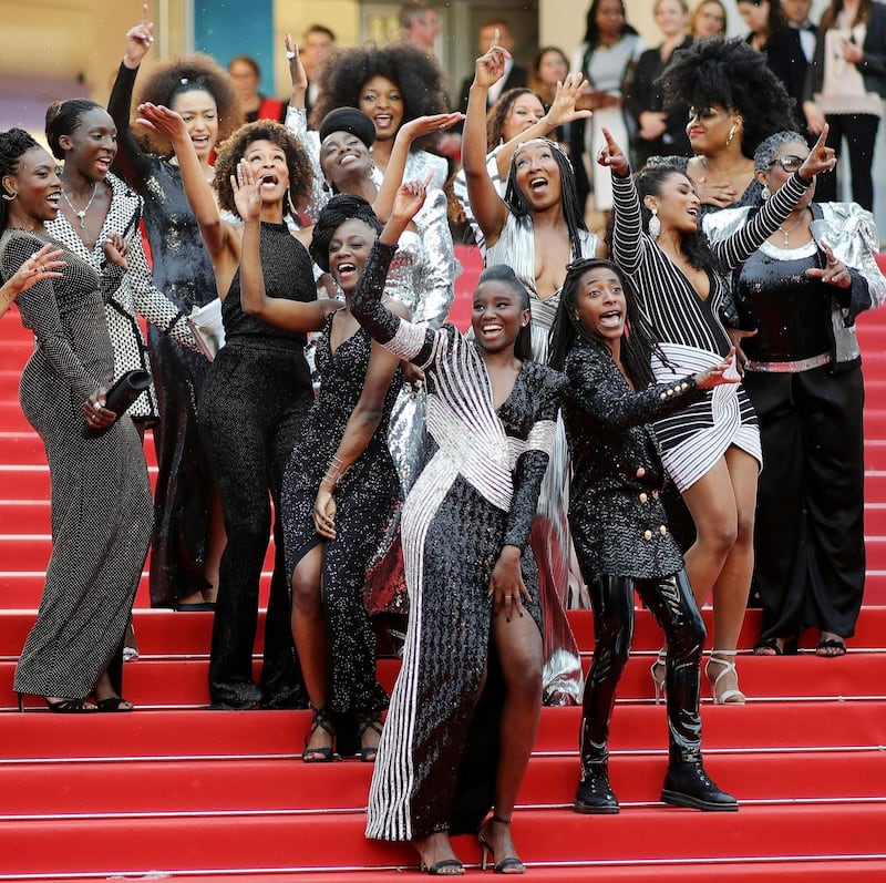 Black Is Not My Job: the book’s authors pose with jury member Khadja Nin. Photograph: Andreas Rentz/Getty