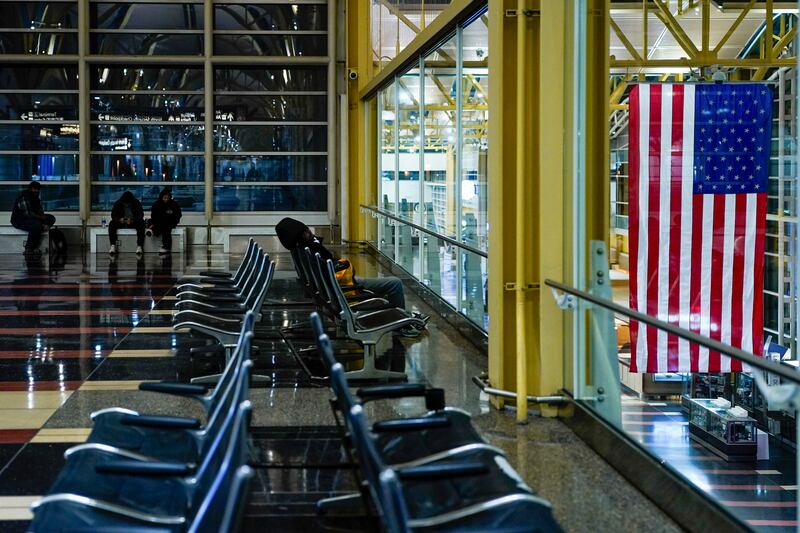 People at the departures level of Ronald Reagan Washington National Airport. Photograph: Kent Nishimura/The New York Times
                      