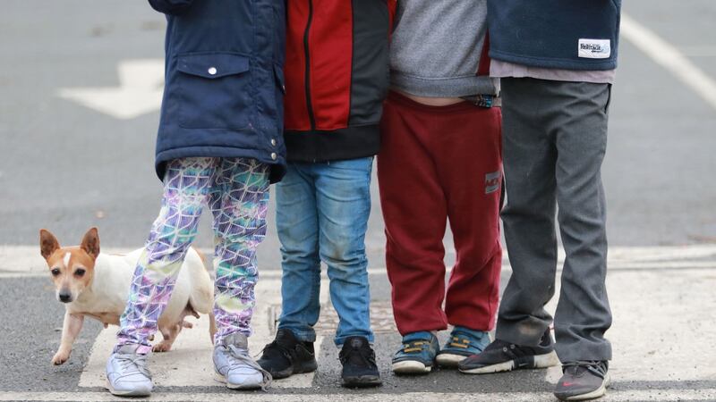 A dog and some of the 28 children who live on the halting site at Balgaddy Road in Clondalkin. Photograph: Nick Bradshaw/The Irish Times.