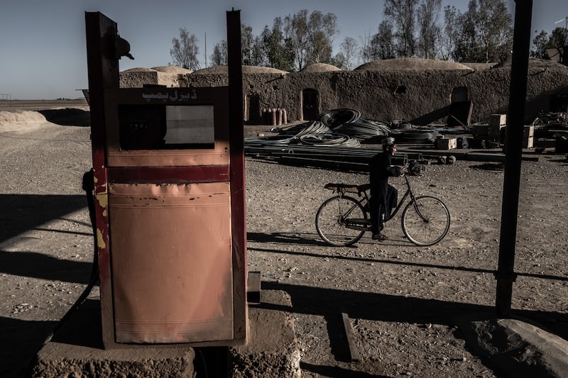 The last working fuel pump at a depot operated by Abdul Khaliq, who once prospered from fixing and selling the water pumps that enabled southwest Afghanistan’s arid Bakwa district to become a hub of the drug trade, in Shagai on April 22nd, 2023. Photograph: Bryan Denton/The New York Times
                      