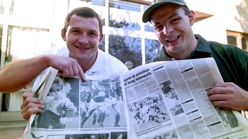 Nick Popplewell with Denis McBride read the papers after Ireland’s victory over Wales. Photograph: Billy Stickland/Inpho