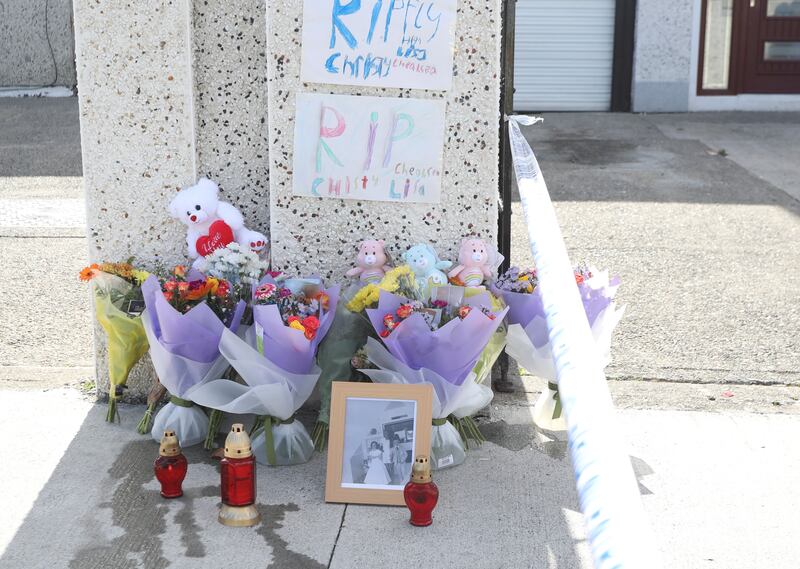 Flowers at the scene on Rossfield estate, Tallaght, Dublin where two children and an adult teenager died after a violent incident at a house. Photograph: Gareth Chaney/ Collins Photos