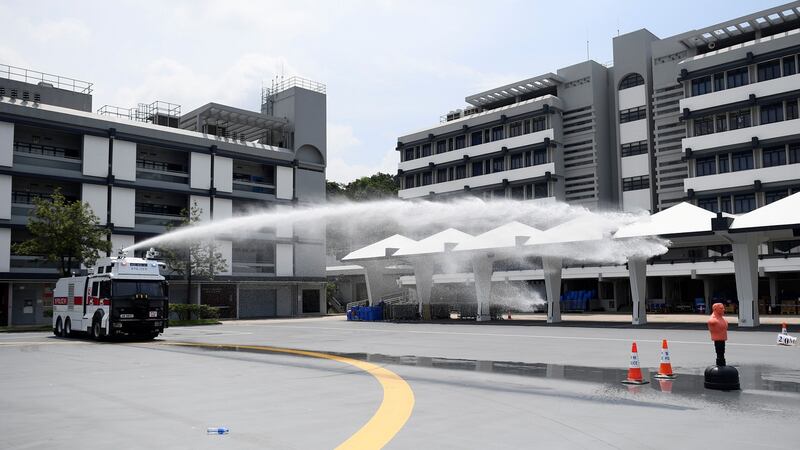 Hong Kong Police demonstrate their new water cannon equipped vehicle at the Police Tactical Unit compound in Hong Kong on Monday. Photograph: Manan Vatsyayana/AFP/Getty Images.