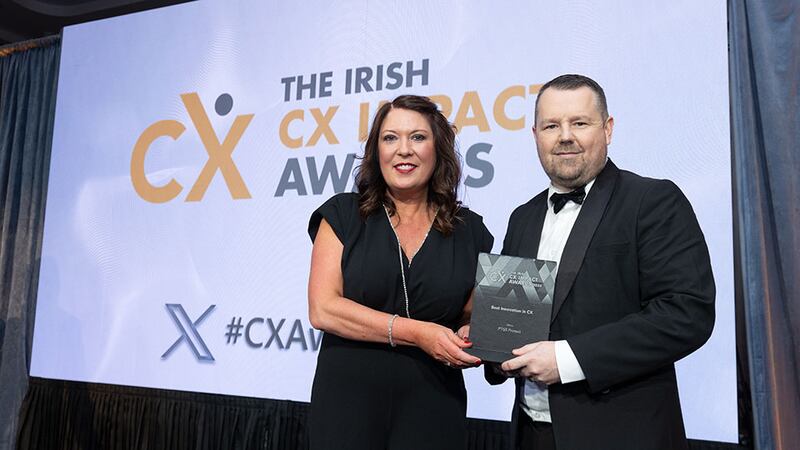 Tara Martin, awards judge, presents the best innovation in CX award to Dave Byrne, PTSB Protect