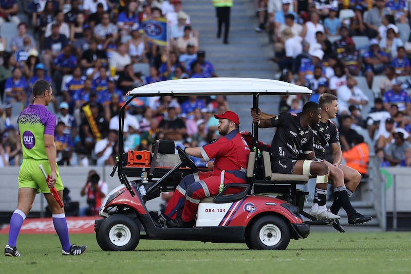 Sharks’ Aphelele Fassi and Andre Esterhuizen leave the field injured. Photograph: EJ Langner/SteveHaagSport/Inpho