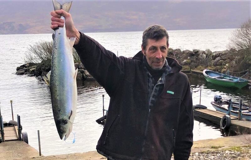 French angler Eric Jouen with his catch, the first Atlantic salmon of 2023 to be caught in Lough Currane in Waterville, Co Kerry.