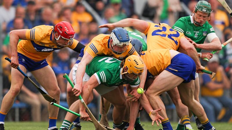 Limerick’s Tom Morrissey leads the challenge for the loose ball. Photograph: Tom Maher/Inpho