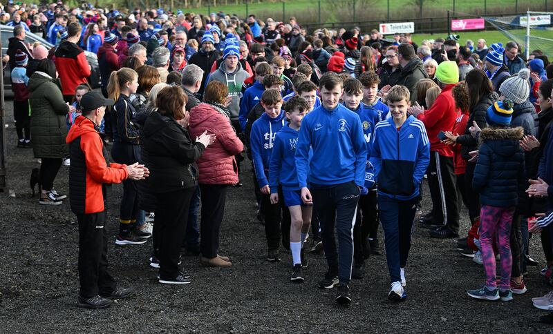 Youths from the Beragh Swifts football club lead a walk of solidarity in support of Detective Chief Inspector John Caldwell on Saturday morning: Photograph: Charles McQuillan/Getty Images