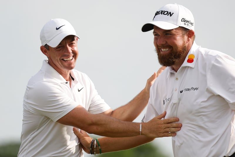 Rory McIlroy and Shane Lowry celebrate. Photograph: Chris Graythen/Getty