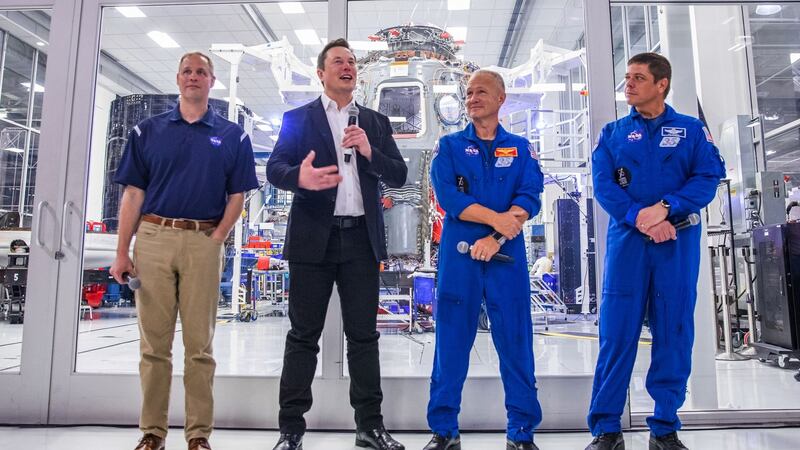 SpaceX founder Elon Musk (second from left) addresses the media alongside Nasa administrator Jim Bridenstine, and astronauts Douglas Hurley  and Robert Behnken, during a press conference announcing new developments of the Crew Dragon reusable spacecraft, at SpaceX headquarters in Hawthorne, California.  Photograph:  Philip Pacheco/AFP