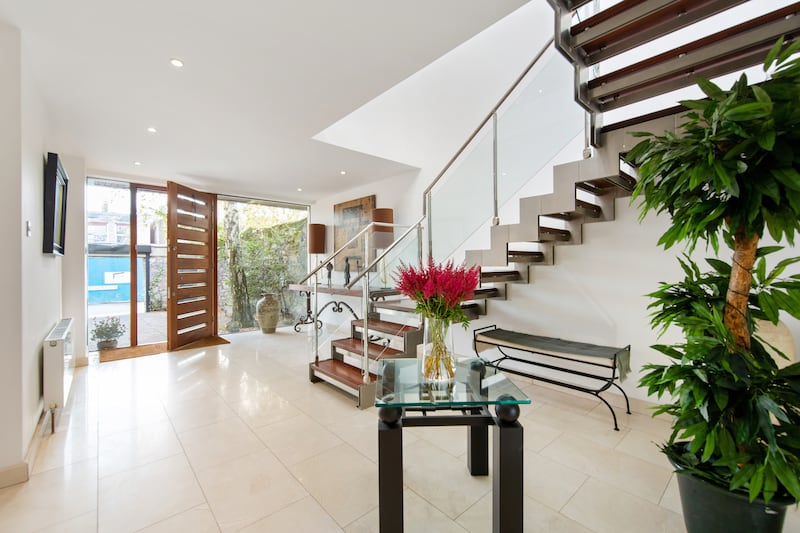 Entrance hall, with glass, wood and steel staircase