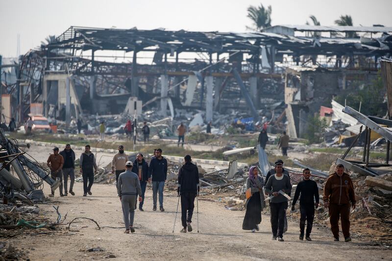 People walk along Salah al-Din road in Nuseirat as they make their way to the northern part of the Gaza strip on Tuesday. Photograph: Eyad Baba/AFP via Getty Images