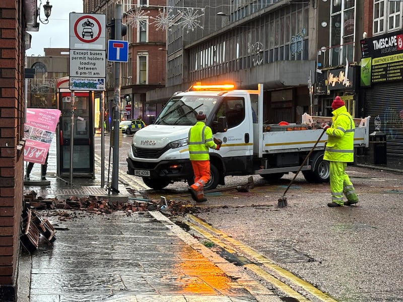 The clean up operation on Castle Street in Belfast city centre after overnight damage caused by Storm Darragh. Photograph: Rebecca Black/PA Wire 