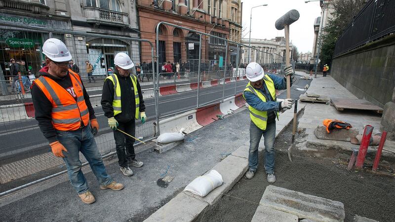 The pavement outside Trinity College  Dublin  being re-laid. Photograph: Dave Meehan