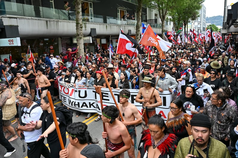 Maori people march through the central business district of Wellington as part of the demonstration. Photograph: Mark Tantrum/AP