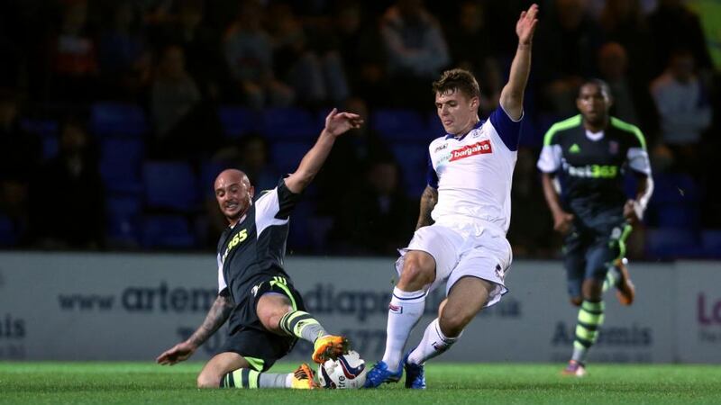 Tranmere Rovers Max Power is tackled by Stoke City goalscorer Stephen Ireland at Prenton Park. Photograph: Peter Byrne/PA Wire