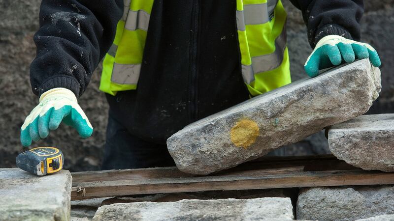 When the pavement outside Trinity College Dublin was removed each slab was numbered or marked so that they would go back down in exactly the same place. Photograph: Dave Meehan