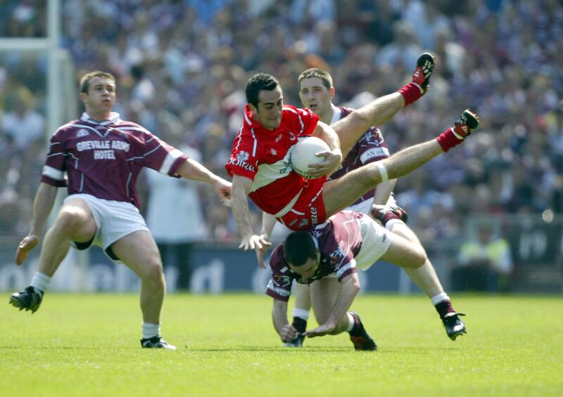  Derry's James Donaghy retains possession despite the efforts of Westmeath's Paul Conway and Fergal Wilson in the 2004 All-Ireland quarter-final. Photograph: Donall Farmer/Inpho