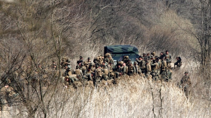 U.S. soldiers arrive for their military training near the demilitarized zone (DMZ) separating North Korea from South Korea in Paju, north of Seoul April 8, 2013. Pyongyang has shown no sign of preparing its 1.2 million-strong army for war, indicating the threats are partly intended for domestic purposes to bolster Kim Jong-Un, the third in his family dynasty to rule North Korea. South Korea's Defence Ministry says it believes new nuclear test is not imminent in North Korea. REUTERS/Lee Jae-Won (SOUTH KOREA - Tags: MILITARY POLITICS)