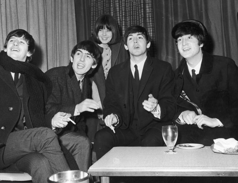 With the Beatles: Maureen Cleave with Ringo Starr, George Harrison, Paul McCartney and John Lennon in the mid-1960s. Photograph: Express/Getty