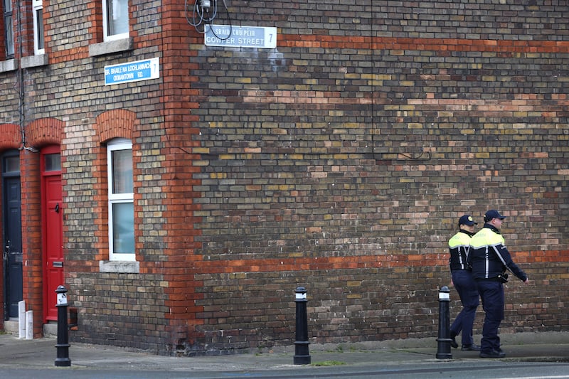 Gardaí patrol on the corner of Oxmantown Road and Cowper Street, Stoneybatter on Monday following a knife attack. Photograph: Dara Mac Dónaill 








