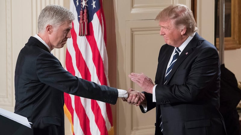 President Donald Trump shaking hands with Neil Gorsuch  after announcing him as his nominee for the supreme court in  January 2017. Photograph: Michael Reynolds/EPA