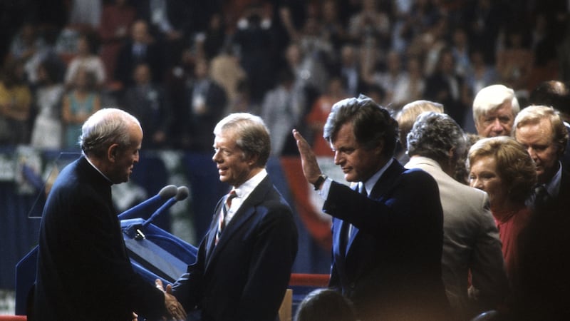 President Jimmy Carter is congratulated by Senator Robert Drinan and presidential candidate senator Ted Kennedy after giving a speech at the Democratic National Convention, New York, August 1980. Photograph:  David Hume Kennerly/Getty