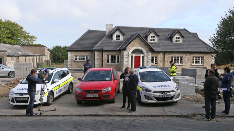 Gardai and reporters  at the scene the  shooting in Saggart, west Dublin, last night. A man in his forties was injured in the incident and later died in hospital. Photograph: Collins