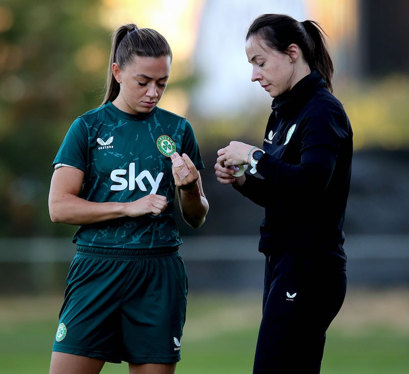 Republic of Ireland captain Katie McCabe with team physio Angela Kenneally. Photograph: Ryan Byrne/Inpho