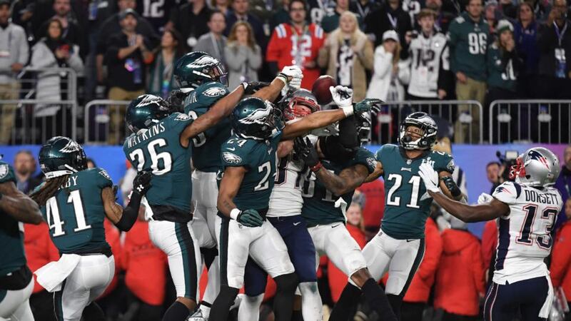 On the final play of the game, Rob Gronkowski  of the New England Patriots, swarmed by the Philadelphia Eagles, fails to catch a pass from   Tom Brady. Photograph: Getty Images