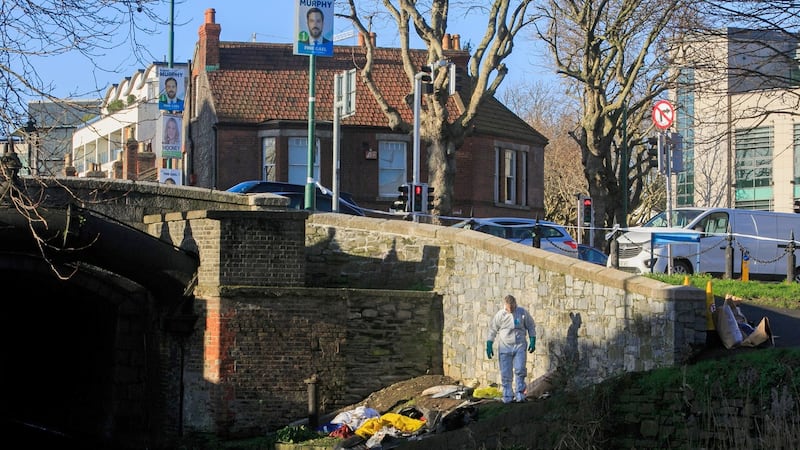 Gardaí at the scene where Adane's tent was moved on the banks of the Grand Canal in Dublin. Photograph: Gareth Chaney/Collins