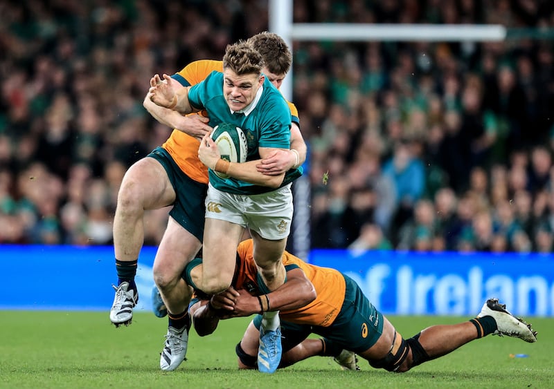 Ireland's Garry Ringrose is tackled by Australia's Billy Pollard and Rob Valetini. Photograph: Dan Sheridan/Inpho