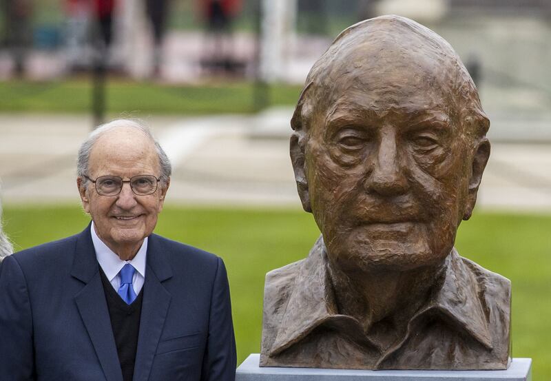 Senator George Mitchell stands at Queen's University Belfast beside a newly unveiled bust of himself by Irish artist Colin Davidson. Photograph: Liam McBurney/PA